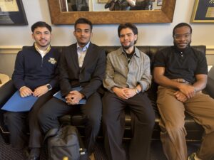 Four of our Young Advocates Leadership Lab sit on a leather sofa in Representative Neal's office after a congressional office visit.