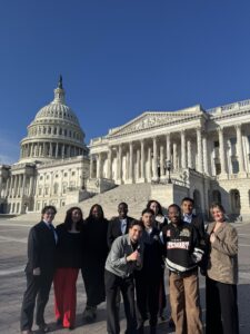 Y.A.L.L. students gather for a photo in front of Capitol Hill before their lobby visits.
